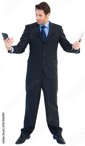 Businessman looking at his calculator and holding tablet pc