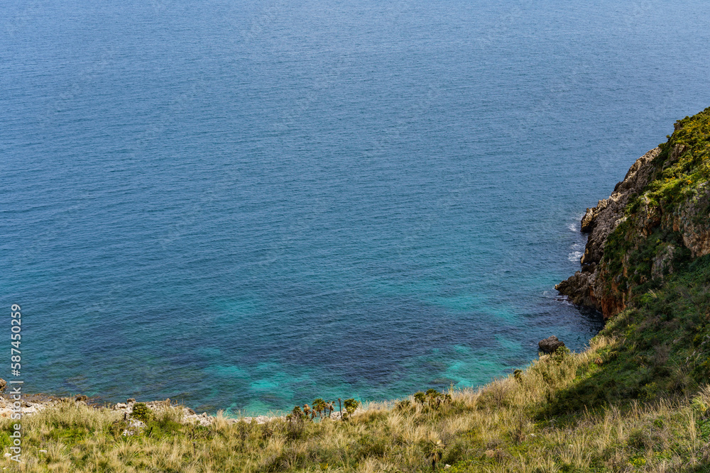 View of the beautiful blue sea falling between the mountain shores. View of the beautiful blue sea falling between the mountain shores.