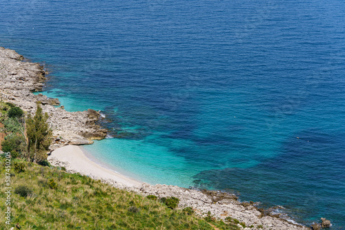 Beautiful stone beach flowing into the wonderful turquoise sea, seen from high mountains. © Tomasz