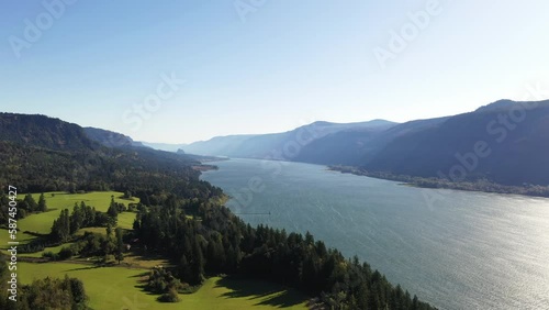 Aerial view of the Columbia river winding it's way through mountains on a smoky bright summers day