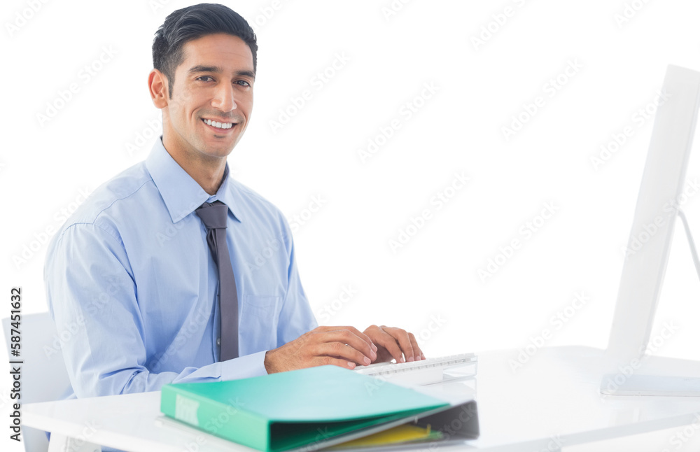 Portrait of handsome businessman using computer at desk 