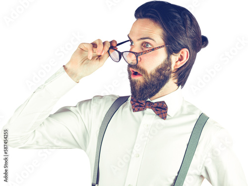 Surprised man holding eyeglasses while looking away