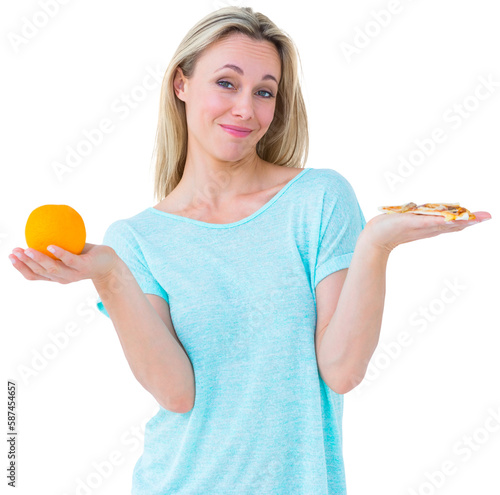 Pretty blonde holding slice of pizza and orange