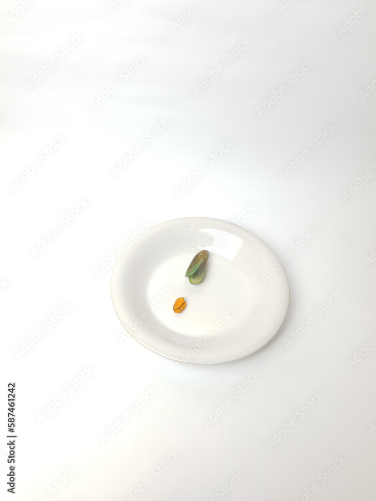 Green Mussel on plate isolated on white background, Fresh New Zealand Mussel or Perna Canaliculus on White Background. Green Mussel on plate isolated on white background, Fresh New Zealand Mussel or Perna Canaliculus on White Background.