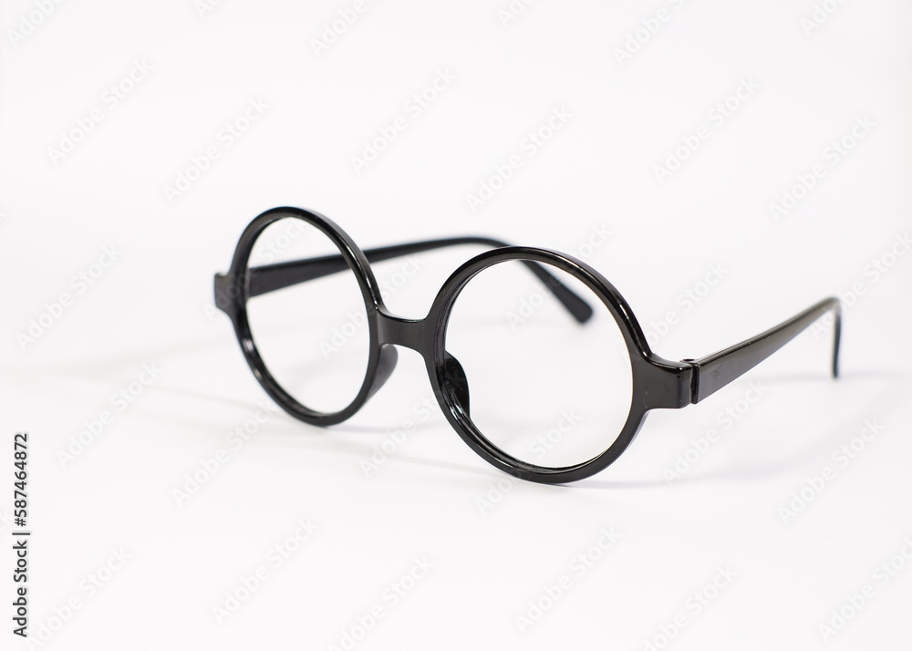 Fototapeta premium Round black eyeglasses isolated on white background. Harry Potter style circle glasses. 