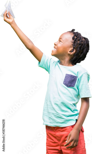 Child holding paper airplane