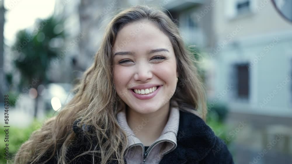 Young beautiful hispanic woman smiling confident standing at street Young beautiful hispanic woman smiling confident standing at street