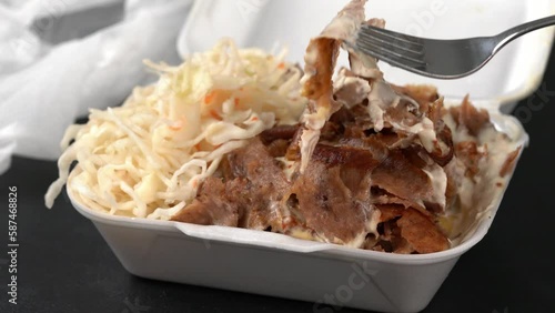 Doner kebab with salad in a plastic box.