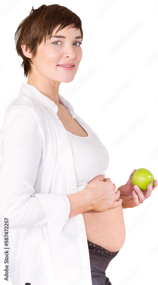 Portrait of expecting woman holding green apple Portrait of expecting woman holding green apple