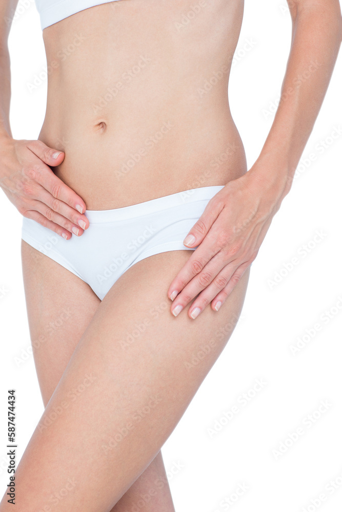 Woman touching her belly and hip 