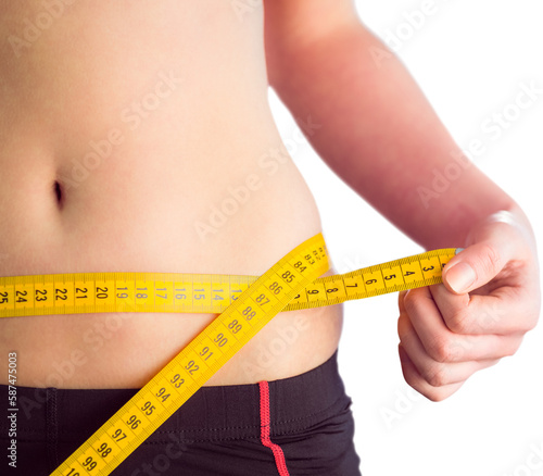 Close-up midsection of a woman measuring waist