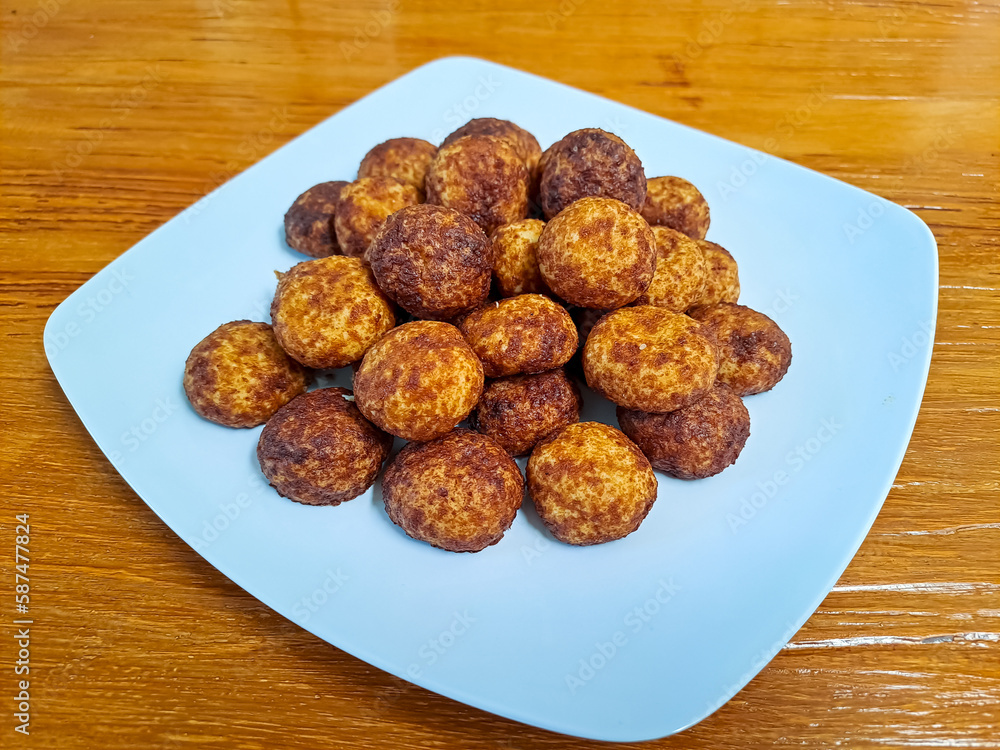 Cheese palm ball cookies, made from flour and cheese, then coated with sweet crunchy palm sugar. Popular serving to celebrate Eid Al Fitr (Lebaran Idul Fitri). Selected focus
Cheese palm ball cookies, made from flour and cheese, then coated with sweet crunchy palm sugar. Popular serving to celebrate Eid Al Fitr (Lebaran Idul Fitri). Selected focus