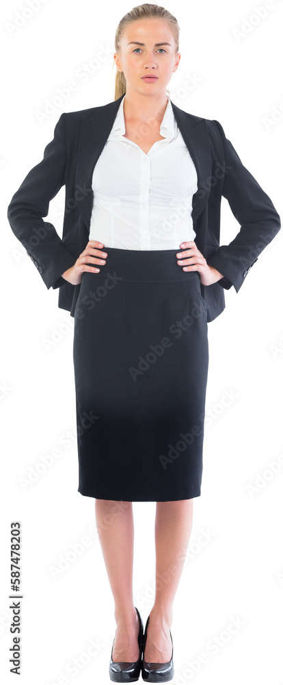 Businesswoman standing with hands on hips