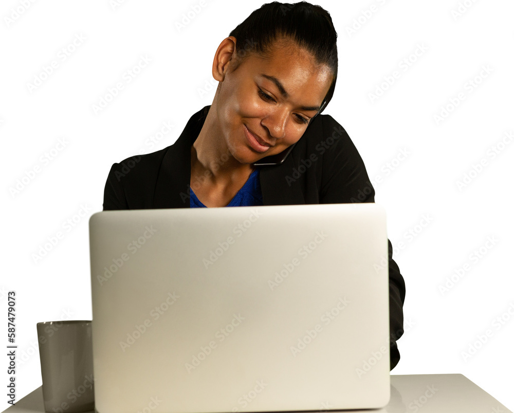 Woman talking on smartphone while using laptop Woman talking on smartphone while using laptop