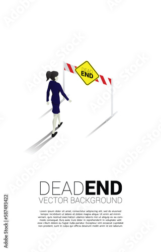 Silhouette businesswoman walking to dead end signage . Concept of wrong decision in business or end of career path.