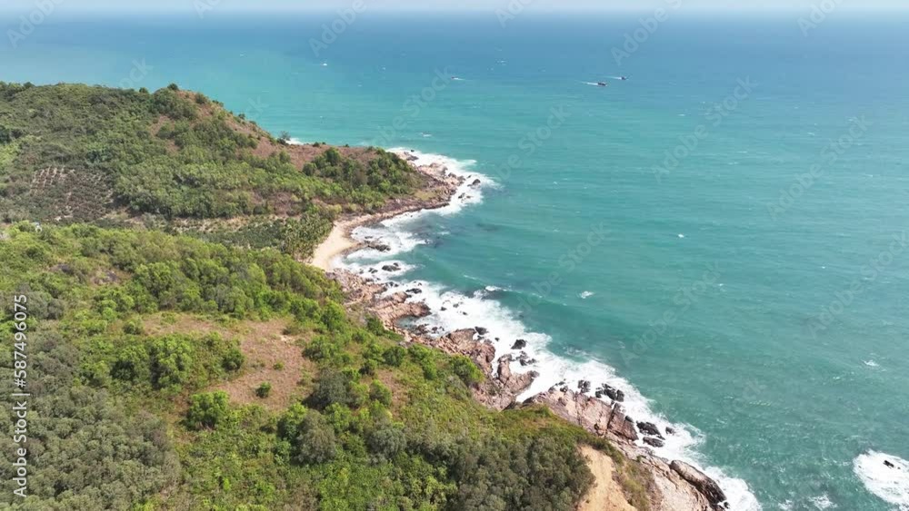 Aerial view Top down seashore. Waves crashing on rock cliff Aerial view Top down seashore. Waves crashing on rock cliff
