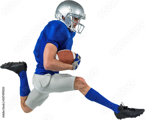 Full length of American football player running with ball