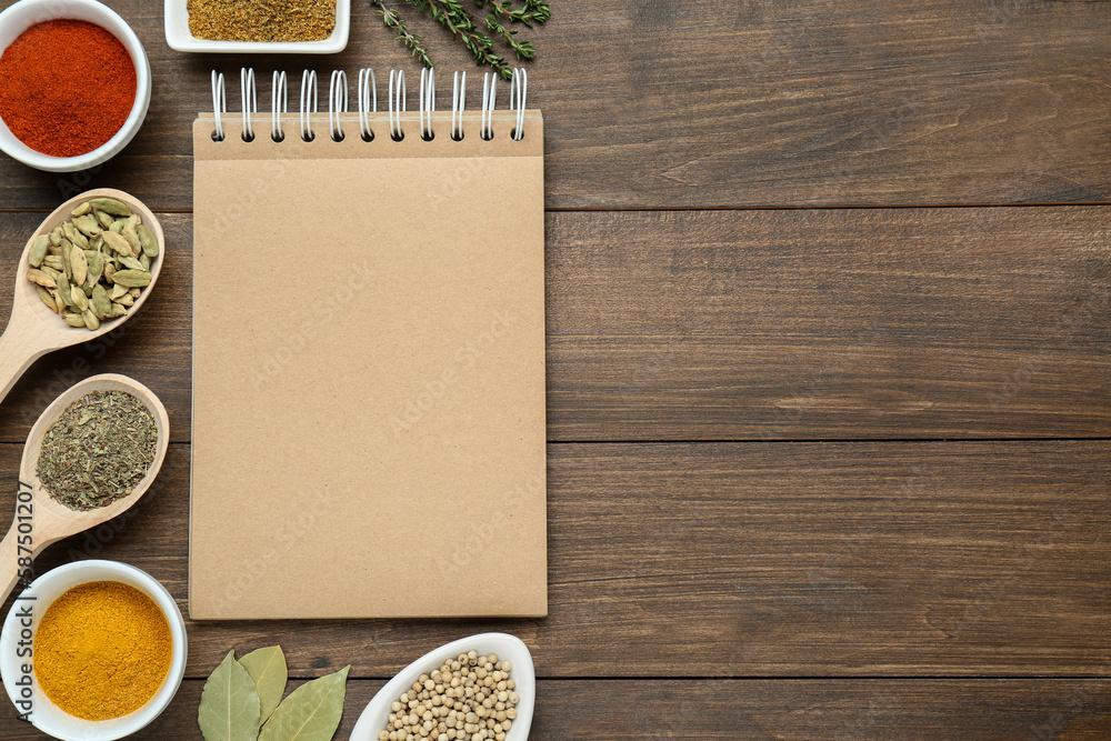 Blank recipe book and different ingredients on wooden table, flat lay. Space for text Blank recipe book and different ingredients on wooden table, flat lay. Space for text