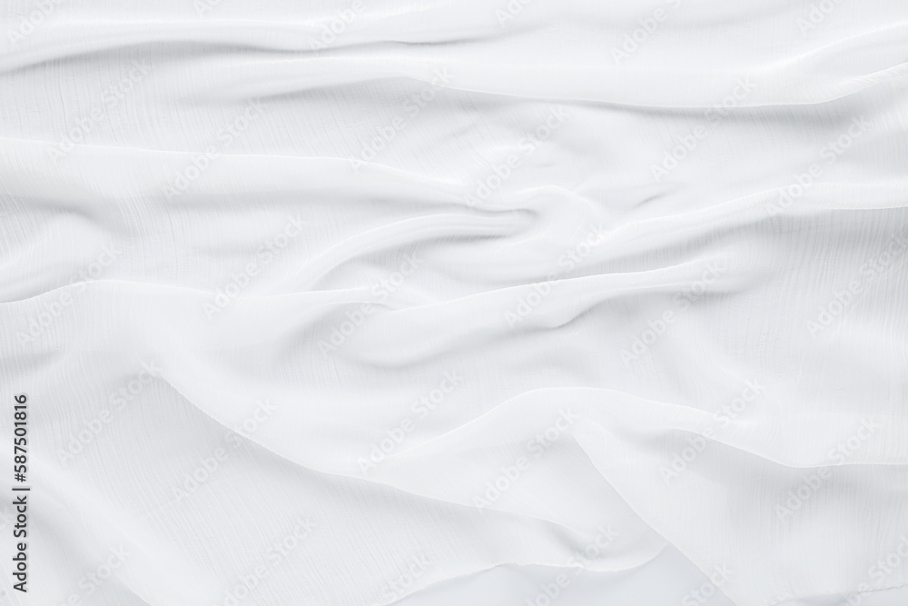 Beautiful white tulle fabric as background, top view Beautiful white tulle fabric as background, top view