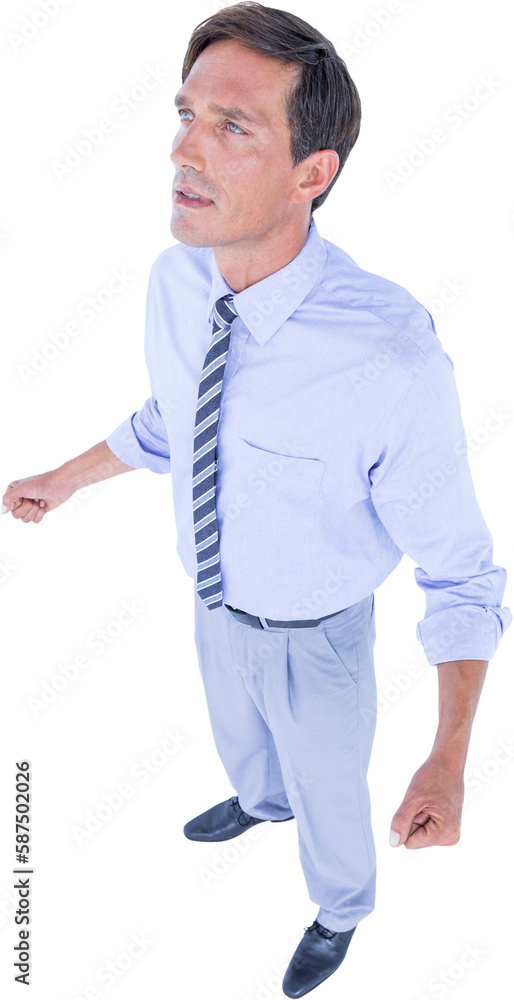 Full length of businessman with clenched fists looking away