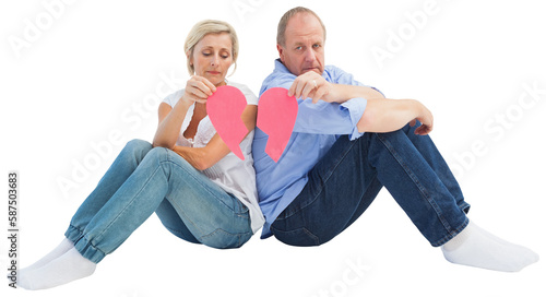 Sad mature couple holding a broken heart
