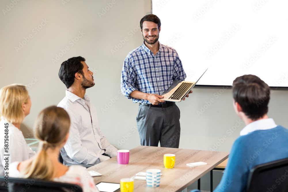 Fototapeta premium Businessman discussing with colleagues