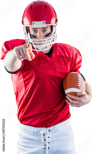 Portrait of american football player holding football and pointing to camera