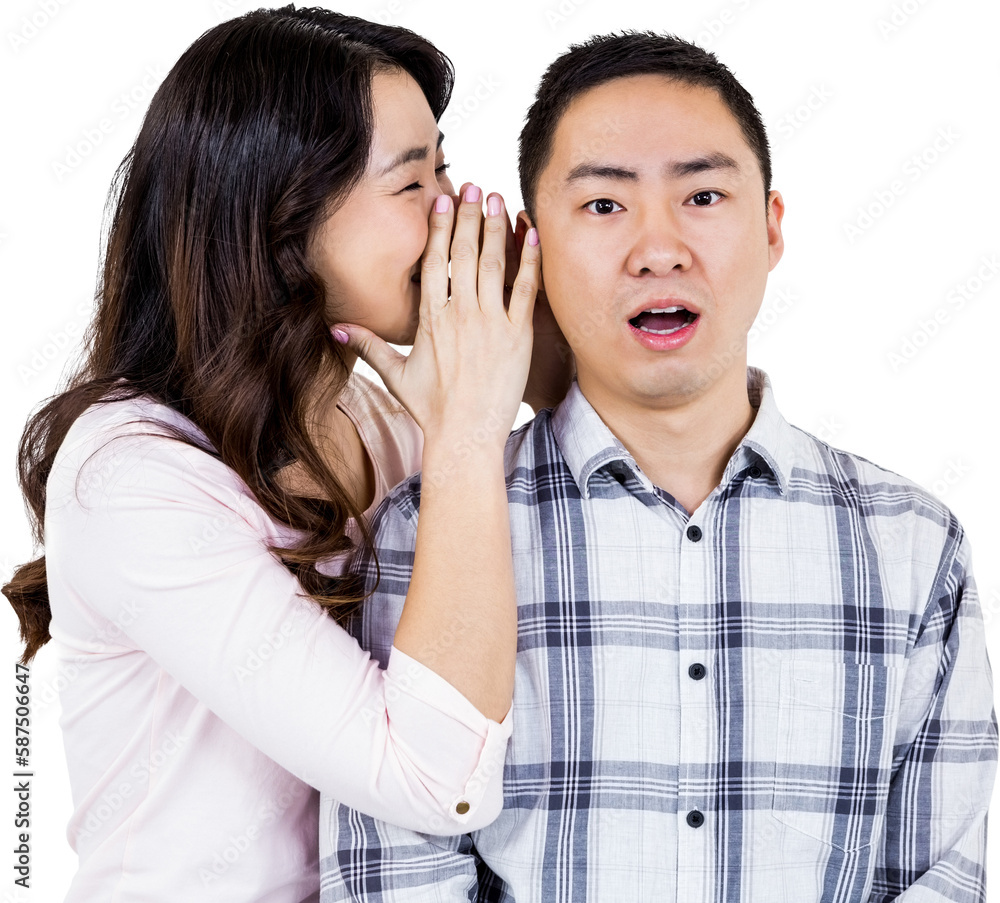 Woman whispering secret to husband Woman whispering secret to husband