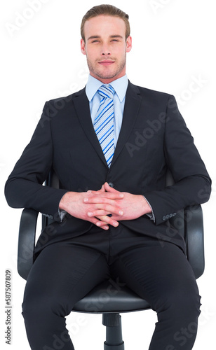 Stern businessman sitting on an office chair
