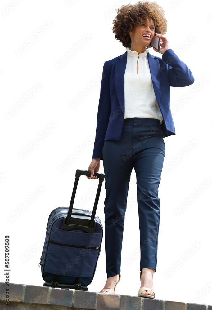Businesswoman with luggage talking on phone Businesswoman with luggage talking on phone