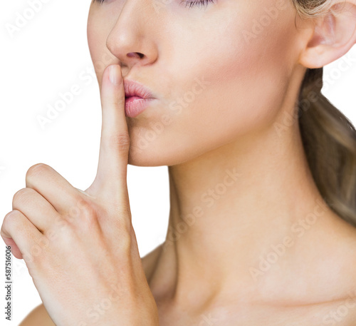 Attractive woman with finger on her lips