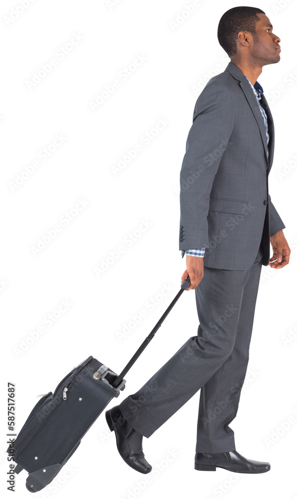 Young businessman pulling his suitcase Young businessman pulling his suitcase
