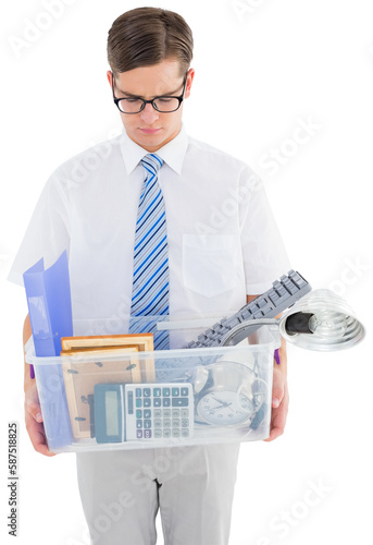 Fired businessman holding box of belongings