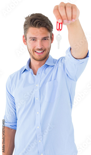 Handsome young man showing new house key