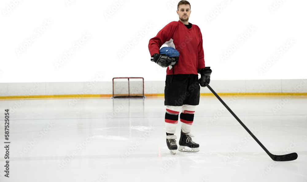 Fototapeta premium Portrait of ice hockey player holding helmet and stick