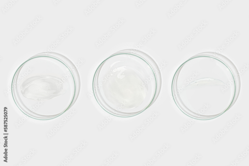 A set of Petri dishes with smeared gel in different shapes. View from above A set of Petri dishes with smeared gel in different shapes. View from above