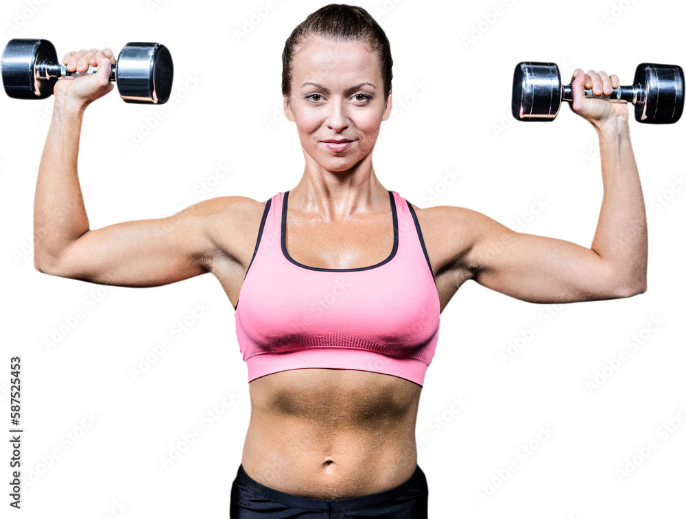 Portrait of smiling woman lifting dumbbells Portrait of smiling woman lifting dumbbells