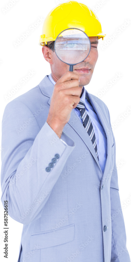 Male architect looking through a magnifying glass Male architect looking through a magnifying glass