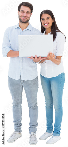 Attractive young couple holding their laptop