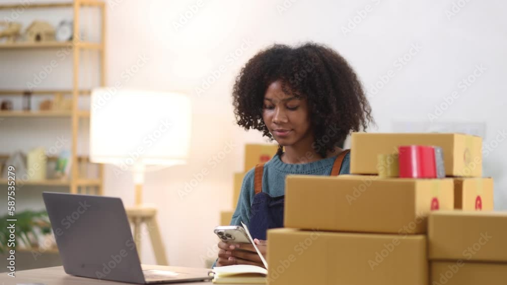 Young African American woman and online selling at home office, Startup small business owner working Online selling and product order for delivery to customer. Young African American woman and online selling at home office, Startup small business owner working Online selling and product order for delivery to customer.