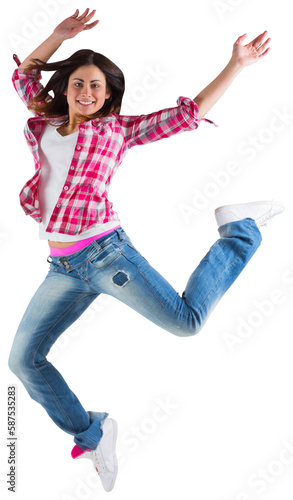 Casual brunette jumping and smiling