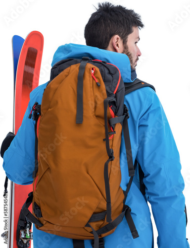 Rear view of skier with backpack