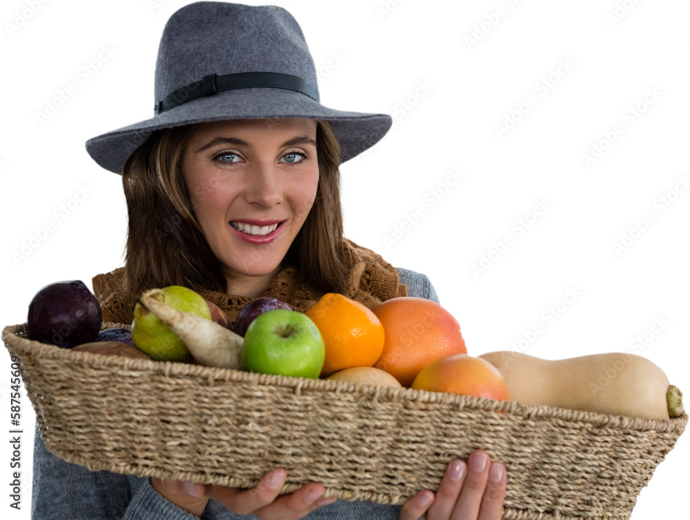 Portrait of young woman carrying fruits and vegetables in basket Portrait of young woman carrying fruits and vegetables in basket
