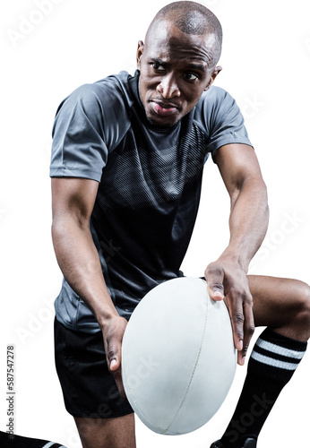 Determined rugby player with ball
