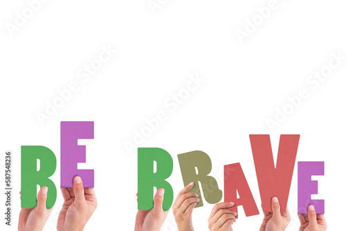 Cropped hands holding colorful words be brave 