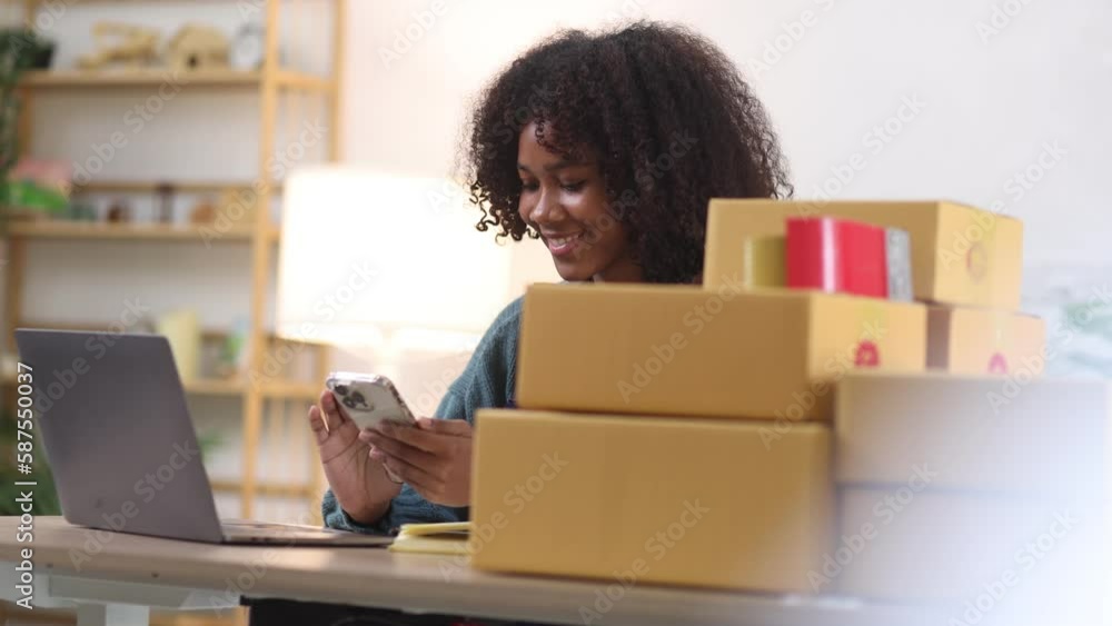 Young African American woman and online selling at home office, Startup small business owner working Online selling and product order for delivery to customer. Young African American woman and online selling at home office, Startup small business owner working Online selling and product order for delivery to customer.