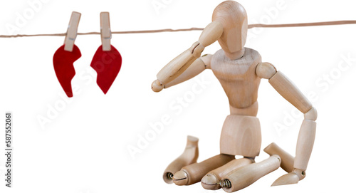 3d illustration of figurine sitting by broken heart 