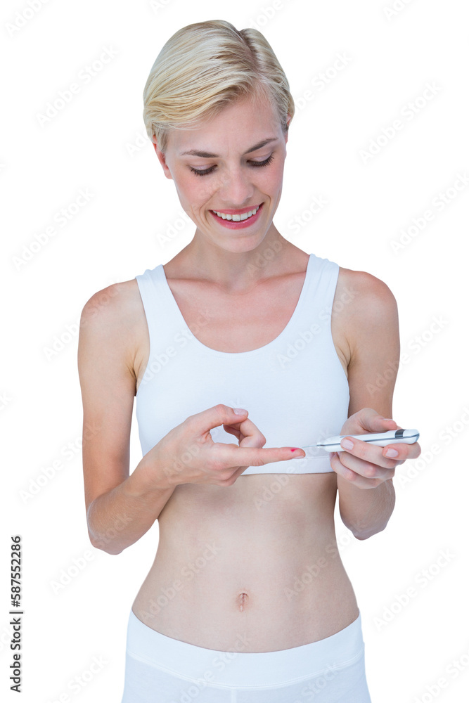 Attractive blonde woman doing test with blood glucose monitor Attractive blonde woman doing test with blood glucose monitor