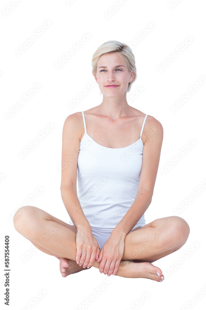 Smiling blonde woman sitting on the floor Smiling blonde woman sitting on the floor