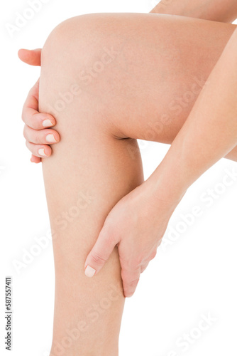 Natural woman touching her painful leg 